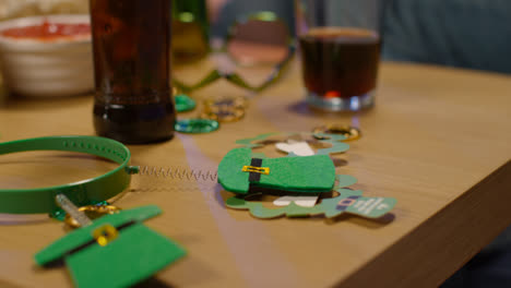 Close-Up-Of-Irish-Novelties-And-Props-Including-Leprechaun-Hat-Deely-Boppers-And-Glasses-Celebrating-At-St-Patrick's-Day-Party